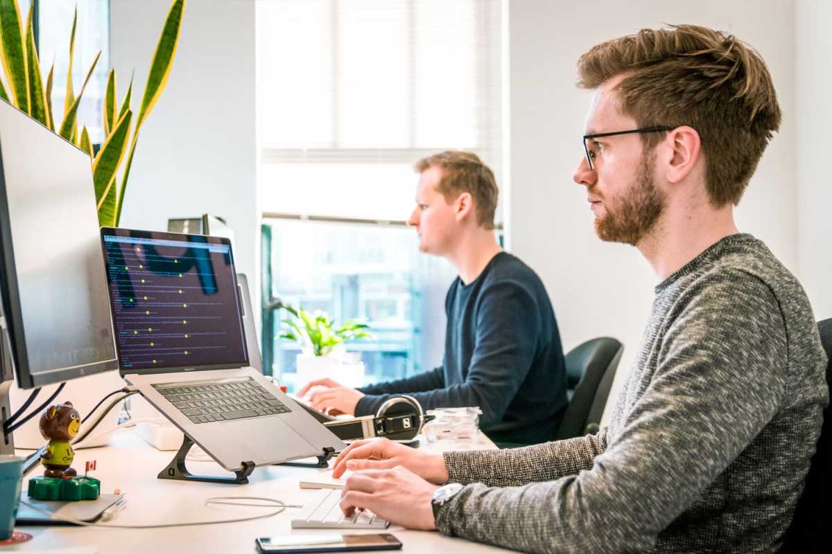 Remote worker uses docking station with laptop